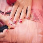 painting-fingernails-nail-polish-hearts-valentine-37553