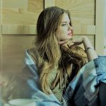 beautiful-young-woman-looking-through-the-window_23-2147611612-1