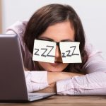 Sleeping Businesswoman Covering His Eyes With The Sticky Notes