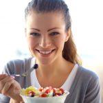 Closeup,Of,Young,Woman,Eating,Healthy,Food