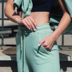 Stylish,Beautiful,Young,Blond,Woman,In,A,Light,Green,Tracksuit