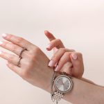 Female,Hands,With,Trendy,Light,Pink,Manicure,Wear,Stylish,Jewerly.